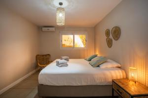 Voodi või voodid majutusasutuse JT Curacao Apartments toas