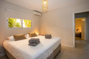 Voodi või voodid majutusasutuse JT Curacao Apartments toas