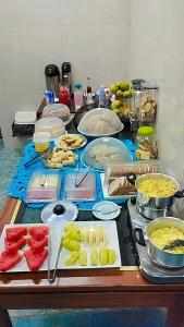 a table with many different types of food on it at Hotel Cuiabá in Cuiabá