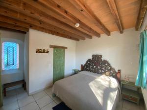 Postel nebo postele na pokoji v ubytování Casa Árbol Hotel