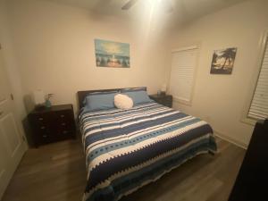 a bedroom with a bed with a pillow on it at Hidden Beach Oasis in Myrtle Beach