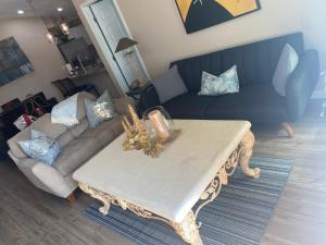 a living room with a table and a couch at Home Sweet Home in Fort Myers