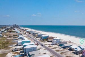 an aerial view of a beach with houses and the ocean at Oceanfront/Zero Steps to Beach/Views/4BR in Gulf Shores