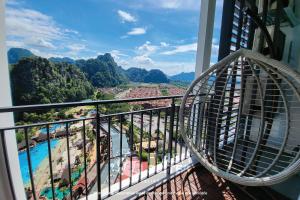 a balcony with a view of a resort at Onsen Premium Suites @ Tambun Ipoh in Ipoh