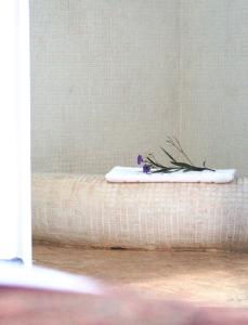 a room with a mattress with flowers on it at El Castillo in Las Galeras