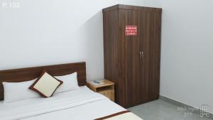 Postel nebo postele na pokoji v ubytování Vy An Hotel