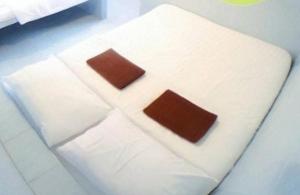 Postel nebo postele na pokoji v ubytování Phangan Mantra Inn