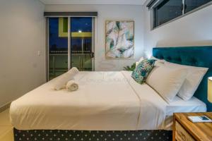 Krevet ili kreveti u jedinici u okviru objekta ZEN CENTRAL Ambient 3BR Apt in the Heart of Darwin