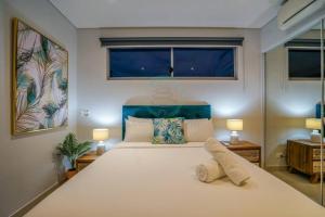 Krevet ili kreveti u jedinici u okviru objekta ZEN CENTRAL Ambient 3BR Apt in the Heart of Darwin