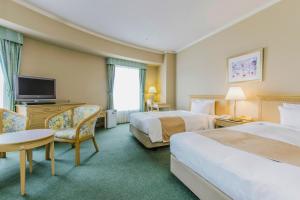 מיטה או מיטות בחדר ב-Authent Hotel Otaru