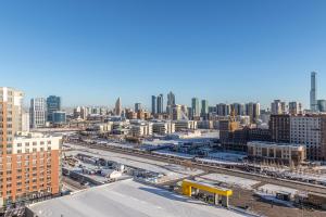 an aerial view of a city with buildings at Квартира в центре города 15-этаж in Astana