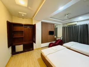Postel nebo postele na pokoji v ubytování Hotel Quỳnh Anh