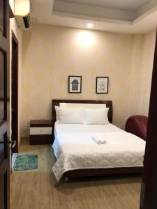 Postel nebo postele na pokoji v ubytování Hotel Quỳnh Anh