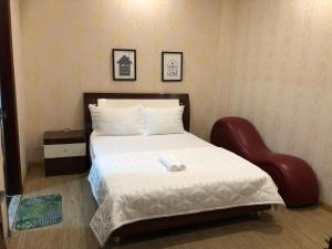 Postel nebo postele na pokoji v ubytování Hotel Quỳnh Anh