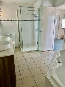 a bathroom with a shower and a toilet and a sink at Captains Nook Cowes in Cowes
