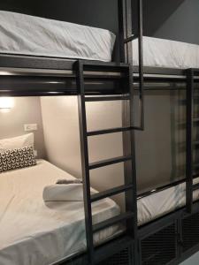 a couple of bunk beds in a room at MyPods @ Bukit Bintang in Kuala Lumpur