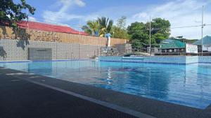 a large pool of water in front of a building at Hip Nautic Beach Resort powered by Cocotel in Lian