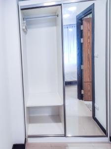 a sliding glass door with a mirror in a room at MBC Mai Khao Beach Condotel LUXURY APARTMENTs in Phuket Town +221 photos