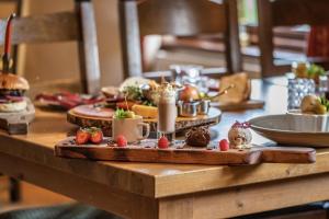 a table with strawberries and other food on it at Wyevalleycateringminers gl16 in Coleford