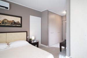 Postel nebo postele na pokoji v ubytování Quadra Key Easy Home In Florence