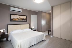 Postel nebo postele na pokoji v ubytování Quadra Key Easy Home In Florence + 15 fotografií