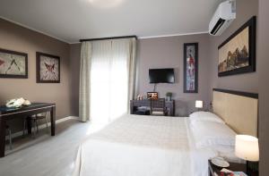 Postel nebo postele na pokoji v ubytování Quadra Key Easy Home In Florence