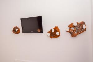 A television and/or entertainment centre at Rubini City Apartment