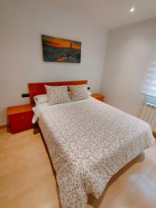 A bed or beds in a room at Tirwal Suite San Juan