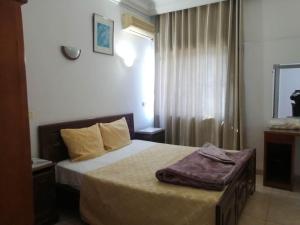 Postel nebo postele na pokoji v ubytování Hotel El Layeli