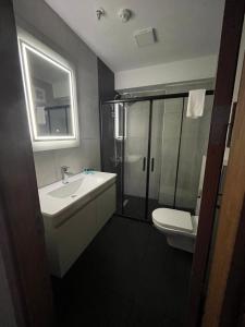 a bathroom with a sink and a shower and a toilet at Seher HOTEL in Istanbul