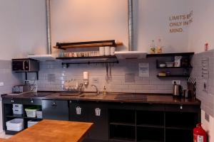 a kitchen with a sink and a counter top at Prague Dream Hostel in Prague