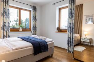 Posteľ alebo postele v izbe v ubytovaní udanypobyt Apartamenty Tuwima