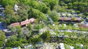 an overhead view of a resort with trees and cars at Campeggio Pian Dei Boschi in Pietra Ligure