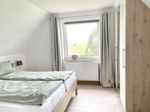 Postel nebo postele na pokoji v ubytování Haus Schwalbennest