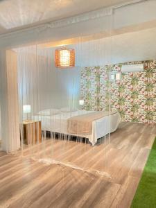 a room with two beds and a table in it at Space One in Manuel Antonio