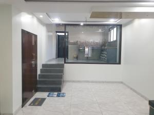 a room with stairs and a window and a door at Hotel Taj Bi Plaza in Aurangabad +19 photos