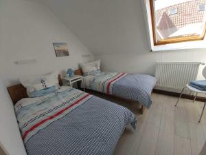 Postel nebo postele na pokoji v ubytování Haus Schwalbennest