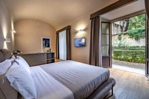 Postel nebo postele na pokoji v ubytování Hotel La Scaletta al Ponte Vecchio + 37 fotografií