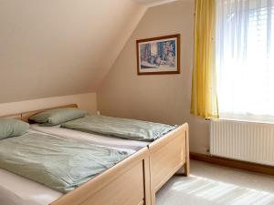 Postel nebo postele na pokoji v ubytování Haus Schwalbennest