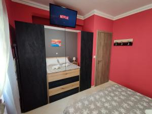 A bed or beds in a room at Silver Pearl Apartment