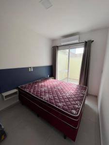 En eller flere senge i et værelse på Ambar beach