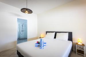 Voodi või voodid majutusasutuse Spanish Water Marina Apartments toas