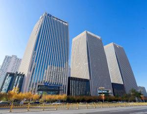 a group of tall buildings in a city at Wyndham Handan Congtai in Handan