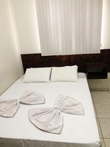 En eller flere senger på et rom på Hotel Ceolatto