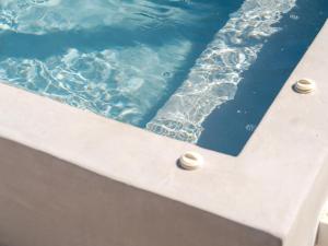 a close up of a swimming pool with water at Villa Arkadia in Parasporos