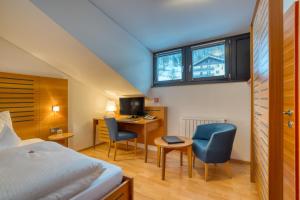 Postel nebo postele na pokoji v ubytování Hotel Cevedale