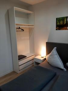 a small bedroom with a bed and a closet at Kelbergerly Hills in Kelberg