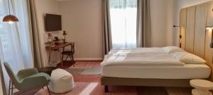 Un pat sau paturi într-o cameră la Hotel St. Josef