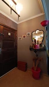 a room with a mirror on the wall next to a door at Chez Axia Tanger in Tangier