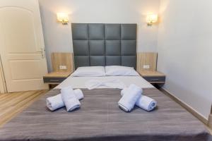 Postel nebo postele na pokoji v ubytování Paradisos Holiday